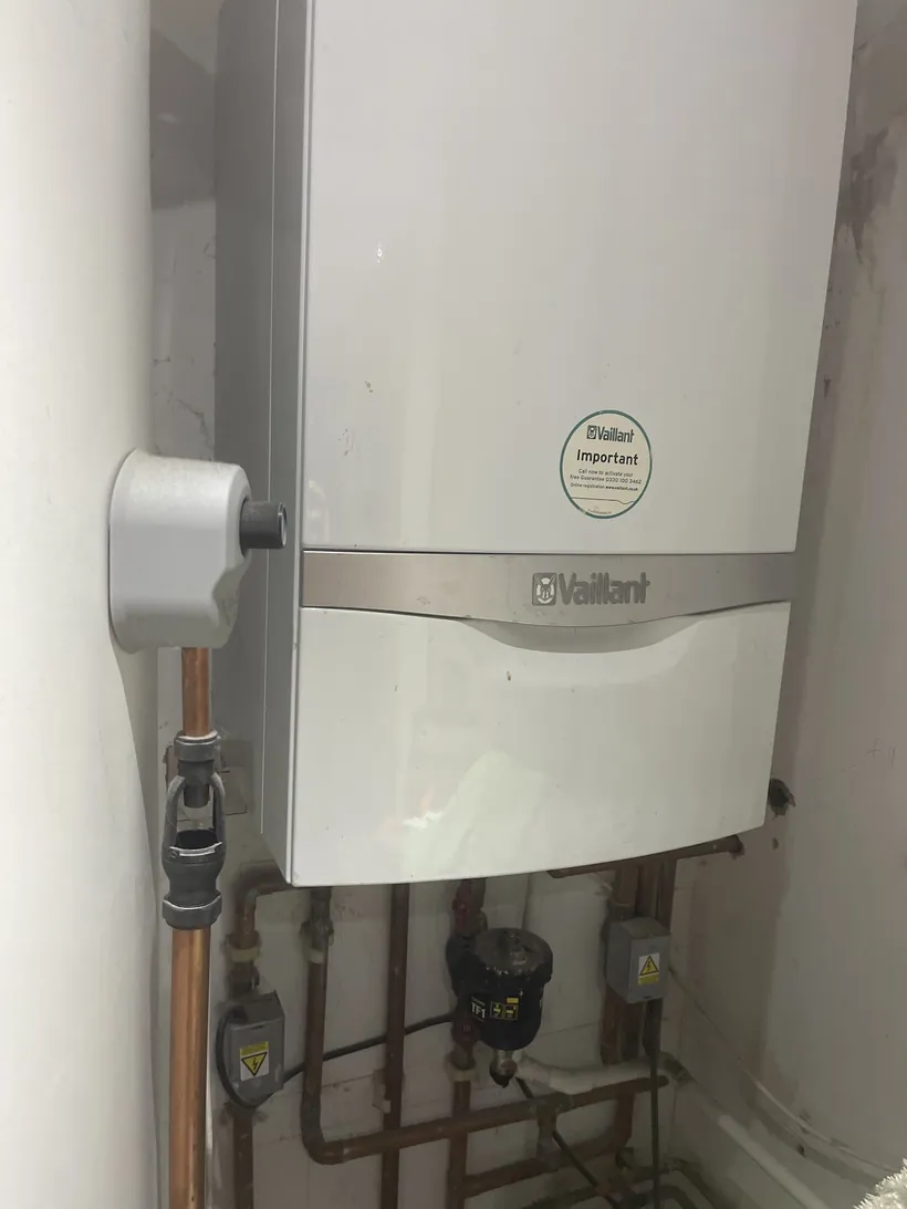 Vaillant ecoTEC boiler with filter and isolation valves underneath